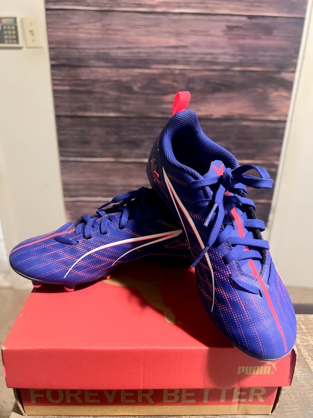 Puma Youth Royal Blue Sneakers with Orange Swoosh Accent